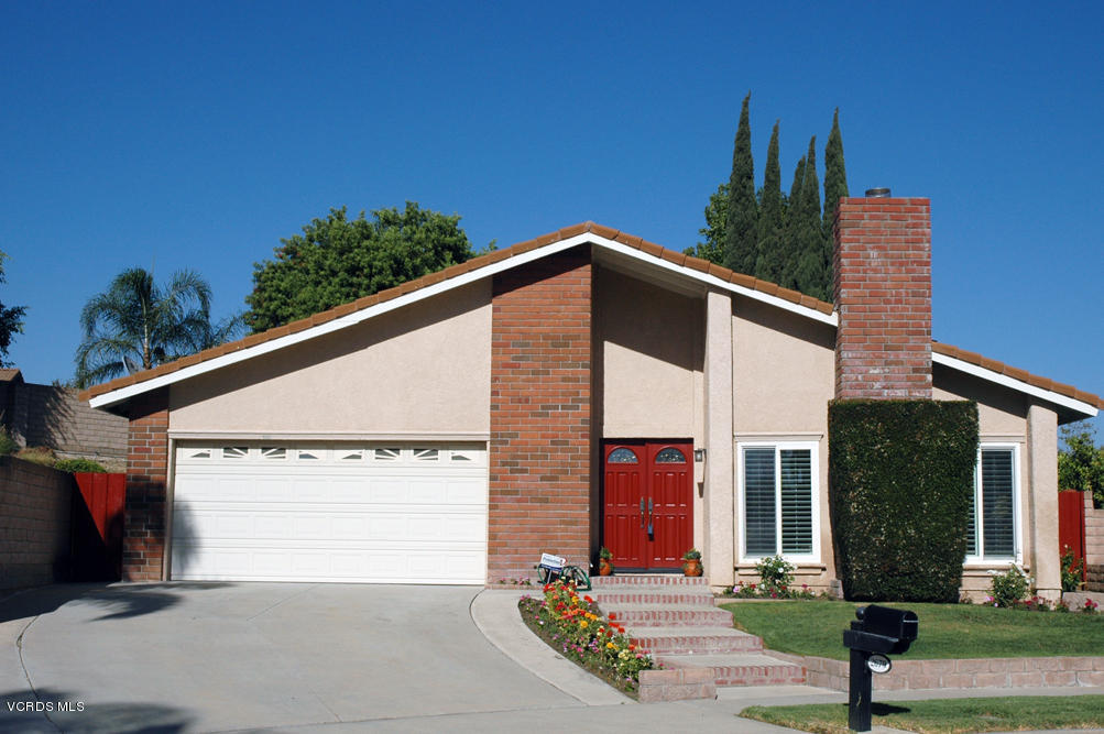 a front view of a house with yard