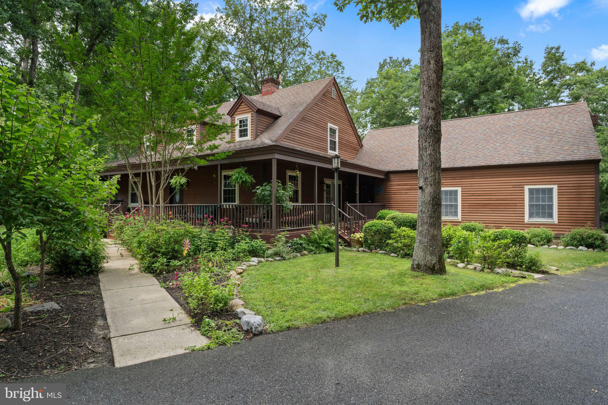 16 Dunhill Road Jackson, NJ 08527 - Photo 2 of 44 Charming home nestled in lush greenery.