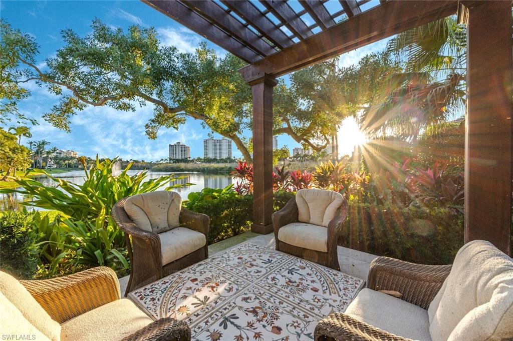 7331 Tilden Lane Naples, FL 34108 - Photo 1 of 50 a balcony with furniture and a potted plant