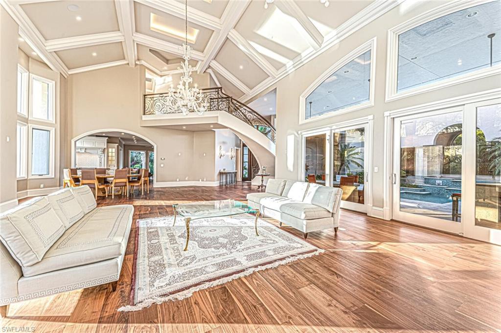 7331 Tilden Lane Naples, FL 34108 - Photo 13 of 50 a living room with fireplace furniture and a large window