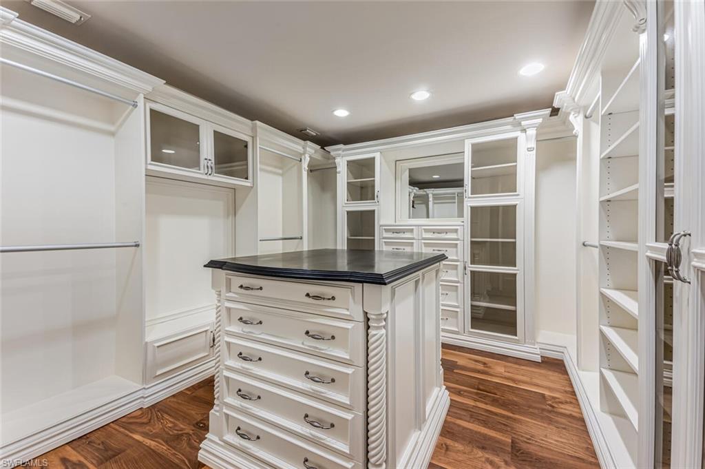 7331 Tilden Lane Naples, FL 34108 - Photo 17 of 50 a view of wooden floor and windows in a room