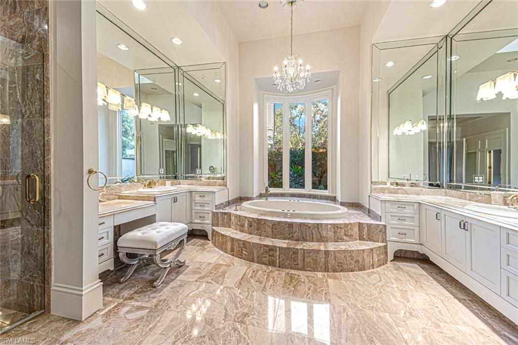 7331 Tilden Lane Naples, FL 34108 - Photo 20 of 50 a spacious bathroom with a large tub and shower