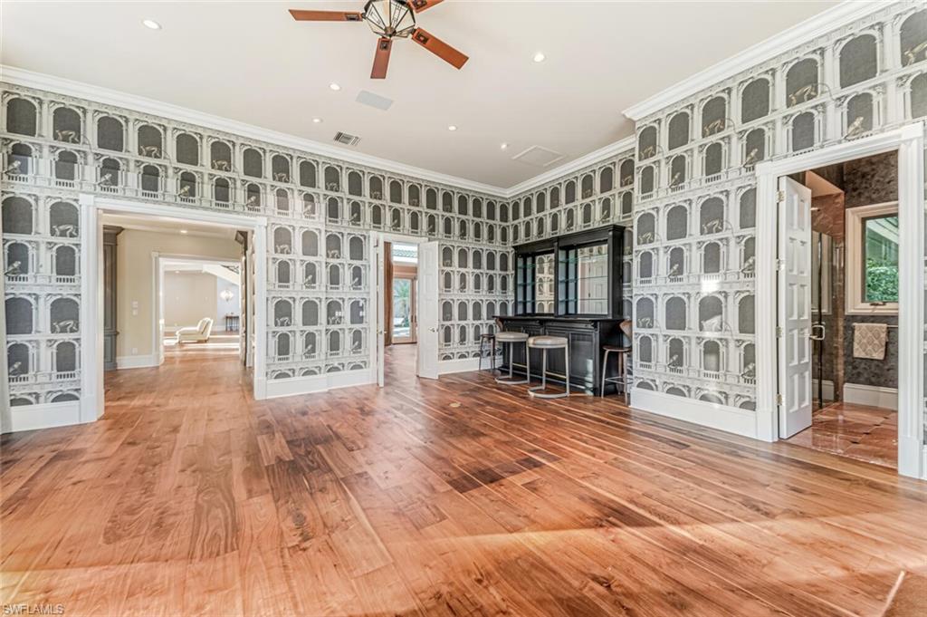 7331 Tilden Lane Naples, FL 34108 - Photo 22 of 50 a view of an large building with wooden floor and windows