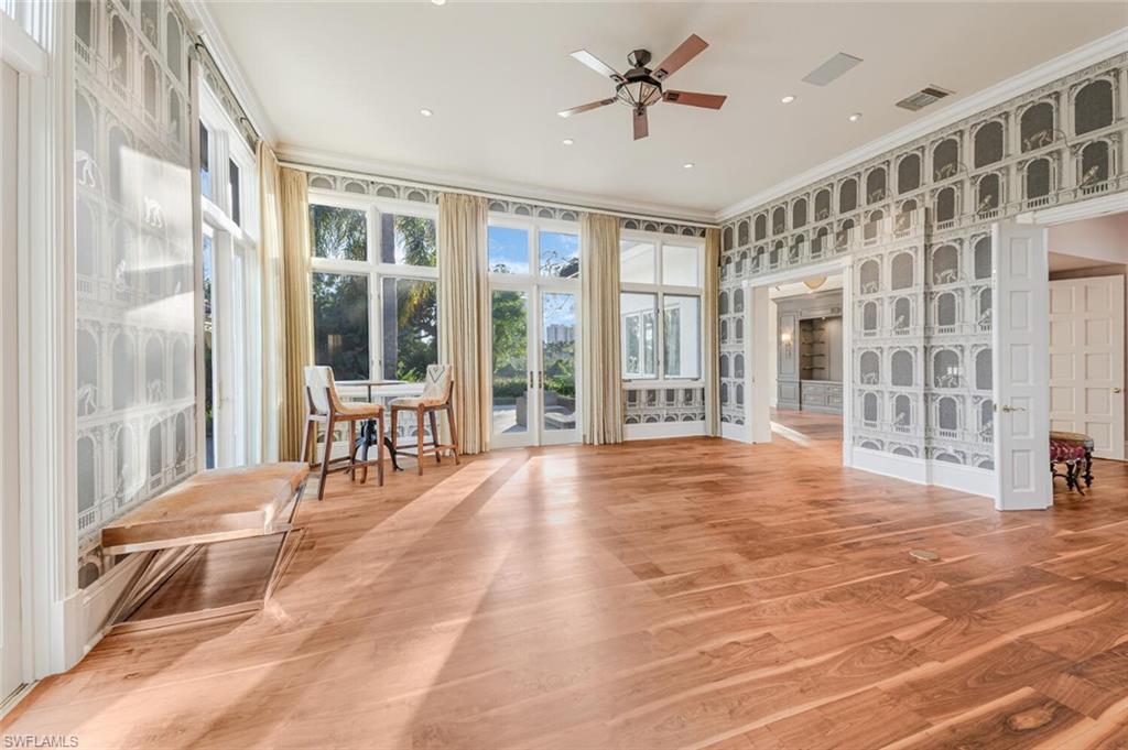 7331 Tilden Lane Naples, FL 34108 - Photo 23 of 50 a view of livingroom with furniture window and wooden floor