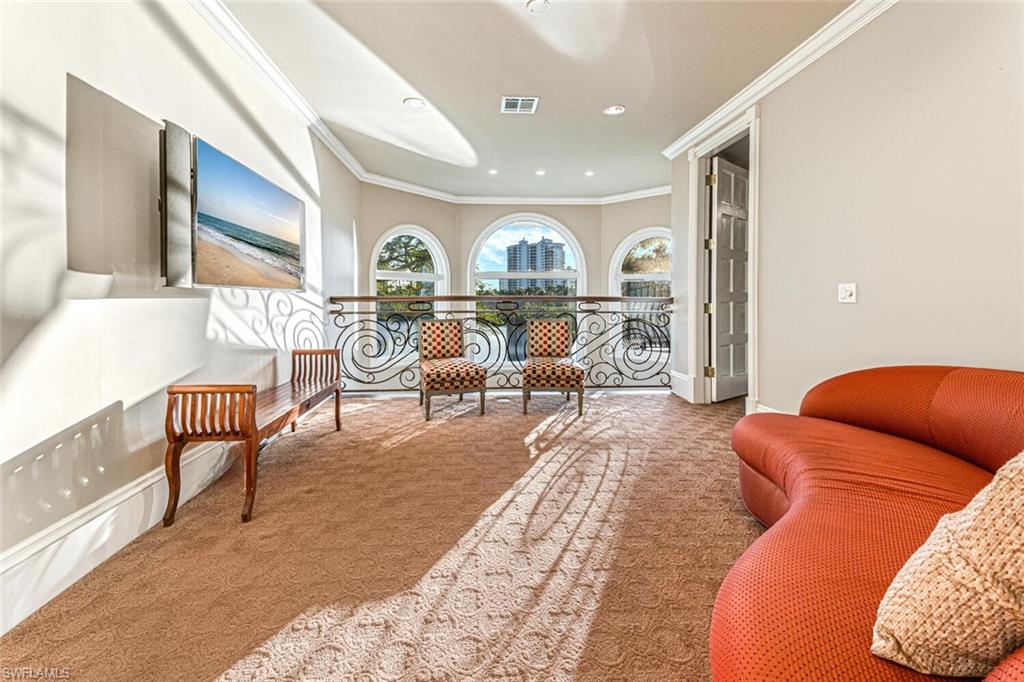 7331 Tilden Lane Naples, FL 34108 - Photo 31 of 50 a living room with furniture and a large window