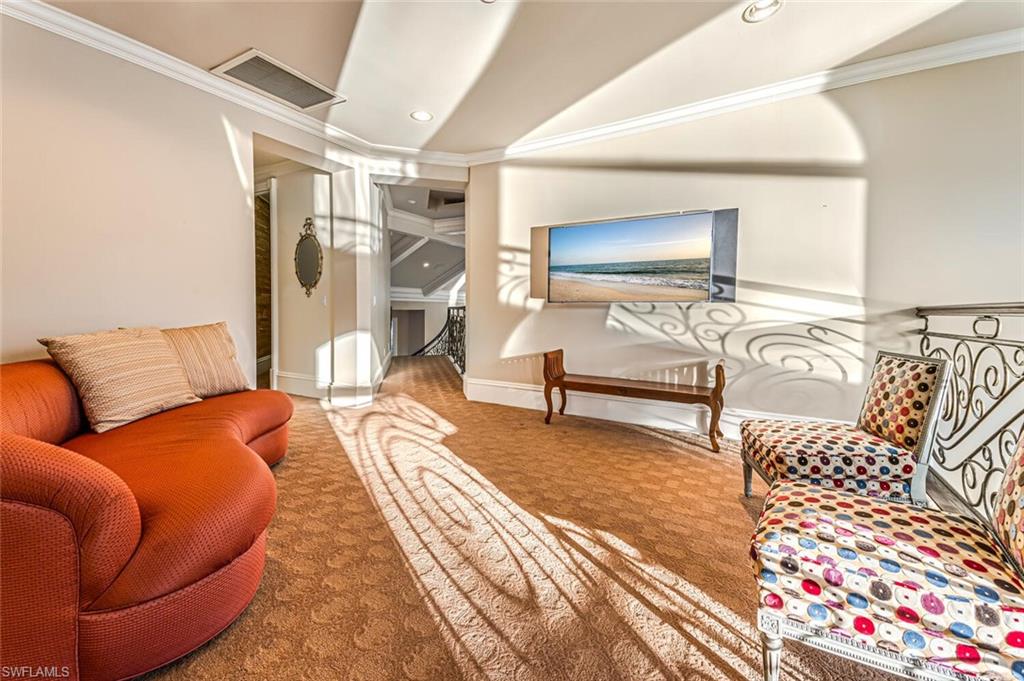 7331 Tilden Lane Naples, FL 34108 - Photo 32 of 50 a bedroom with furniture and wooden floor