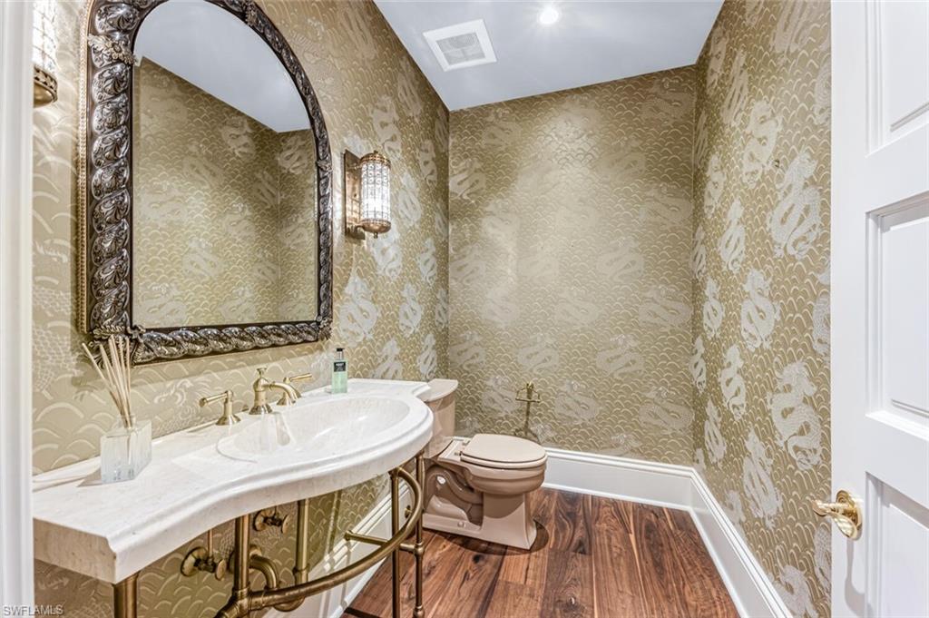 7331 Tilden Lane Naples, FL 34108 - Photo 34 of 50 a bathroom with a sink and a mirror