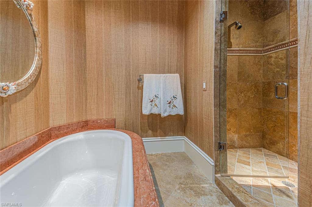 7331 Tilden Lane Naples, FL 34108 - Photo 37 of 50 a bathroom with a bathtub and shower