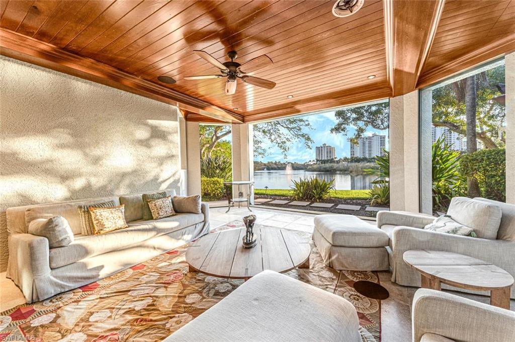 7331 Tilden Lane Naples, FL 34108 - Photo 44 of 50 a living room with furniture and a large window