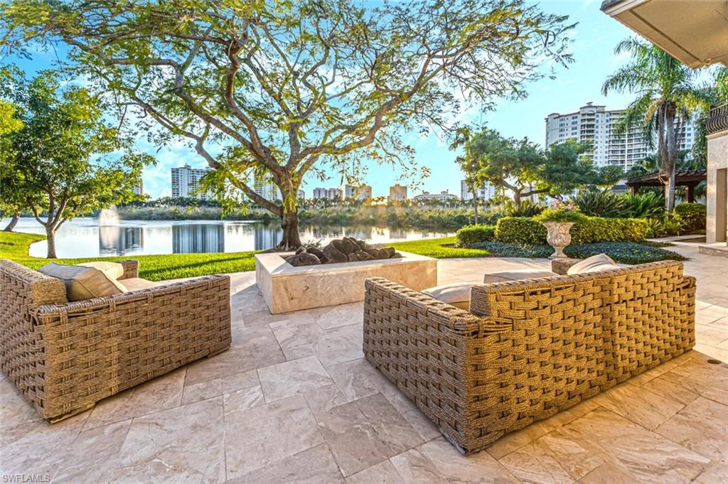 7331 Tilden Lane Naples, FL 34108 - Photo 47 of 50 swimming pool view with couches and a fire pit