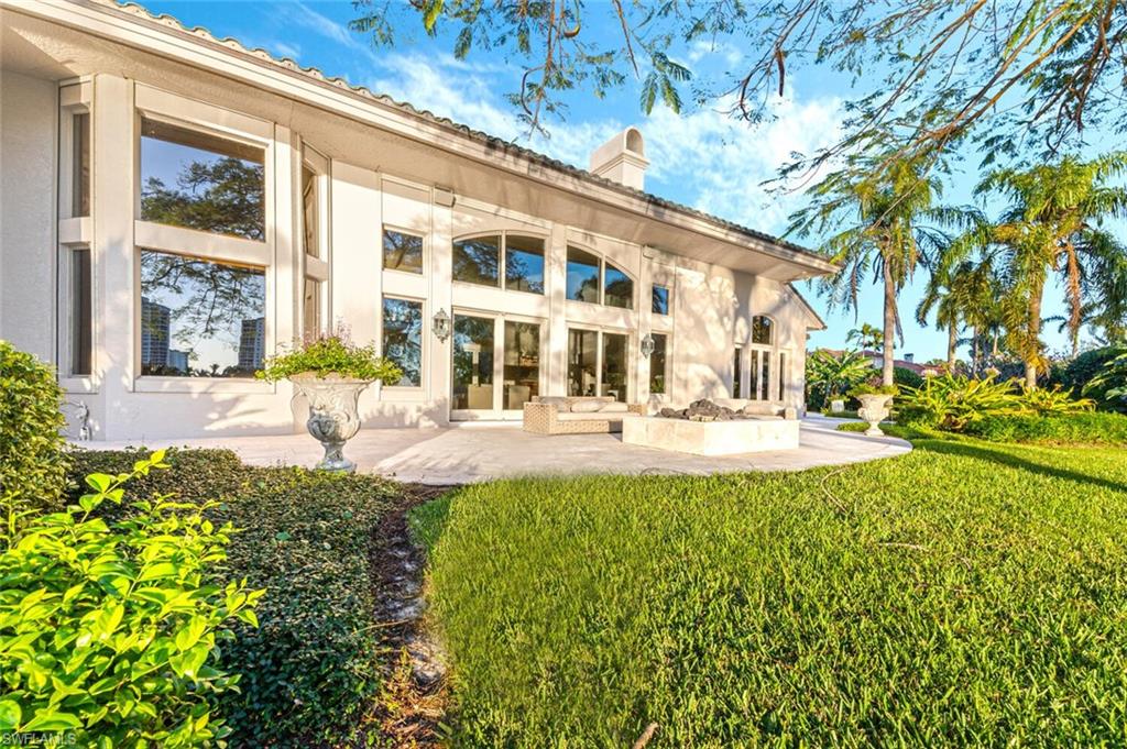 7331 Tilden Lane Naples, FL 34108 - Photo 49 of 50 a view of a building with a yard