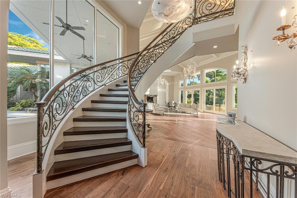 7331 Tilden Lane Naples, FL 34108 - Photo 8 of 50 a view of entryway and hall with wooden floor