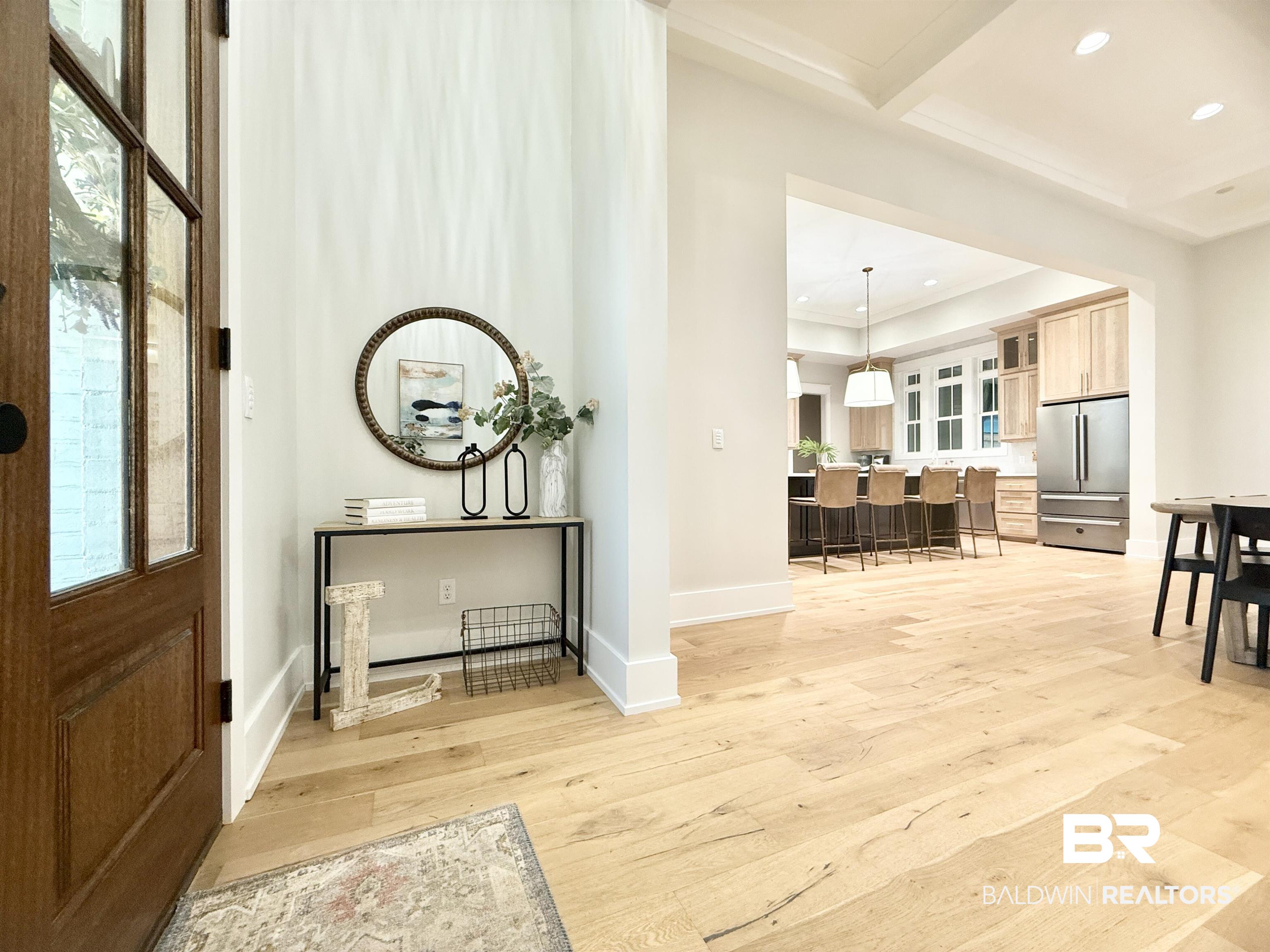 21767 Gallery Boulevard Fairhope, AL 36532 - Photo 5 of 74 Foyer featuring light wood finished floors, recessed lighting, beamed ceiling, ornamental molding, and coffered ceiling
