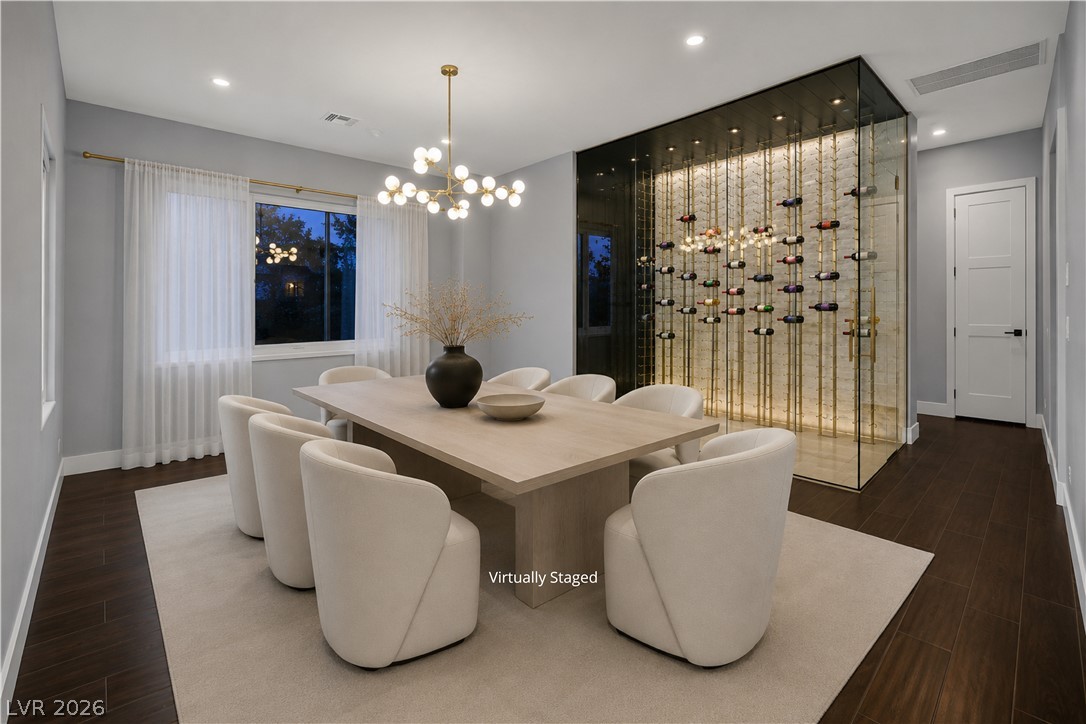 6 Rue Du Ville Henderson, NV 89011 - Photo 8 of 99 “Virtually Staged” dining room offers an elegant setting for entertaining with a distinctive wine display.