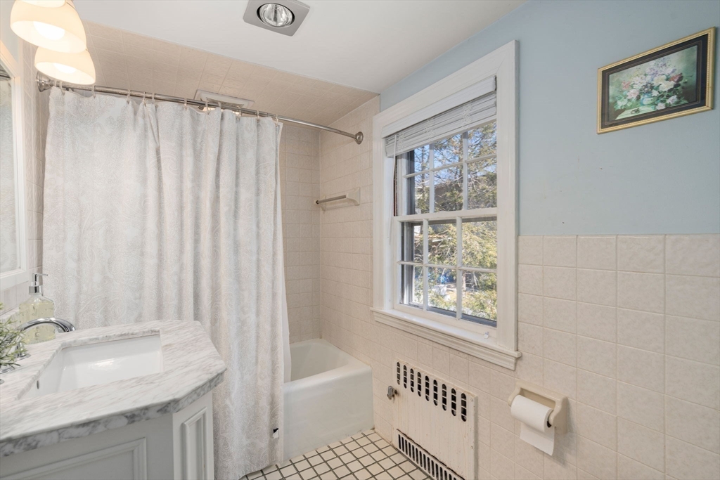 46 Leewood Road Wellesley, MA 02482 - Photo 12 of 16 a bathroom with a sink a bathtub and a shower
