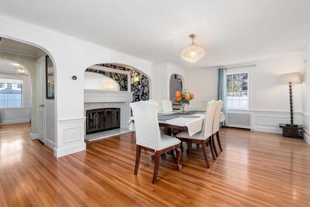 46 Leewood Road Wellesley, MA 02482 - Photo 5 of 16 a living room with furniture a fireplace and wooden floor