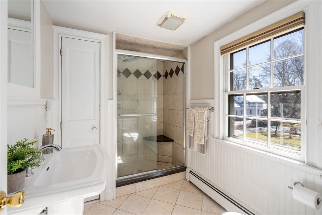 46 Leewood Road Wellesley, MA 02482 - Photo 9 of 16 a bathroom with a bathtub and a shower