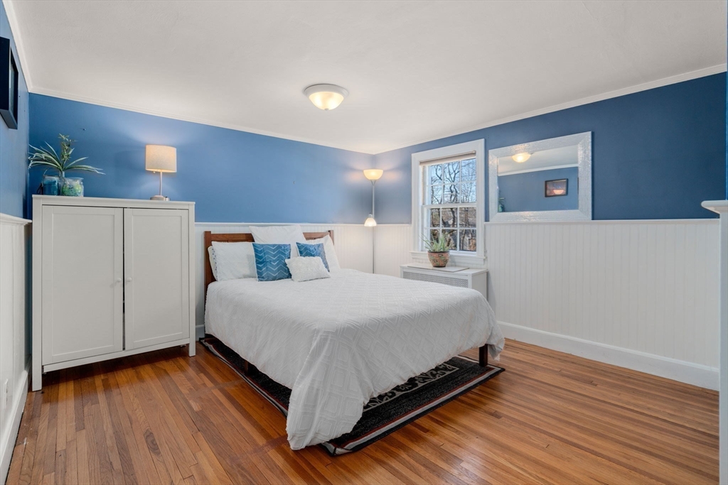 46 Leewood Road Wellesley, MA 02482 - Photo 10 of 16 a bedroom with a bed and wooden floor