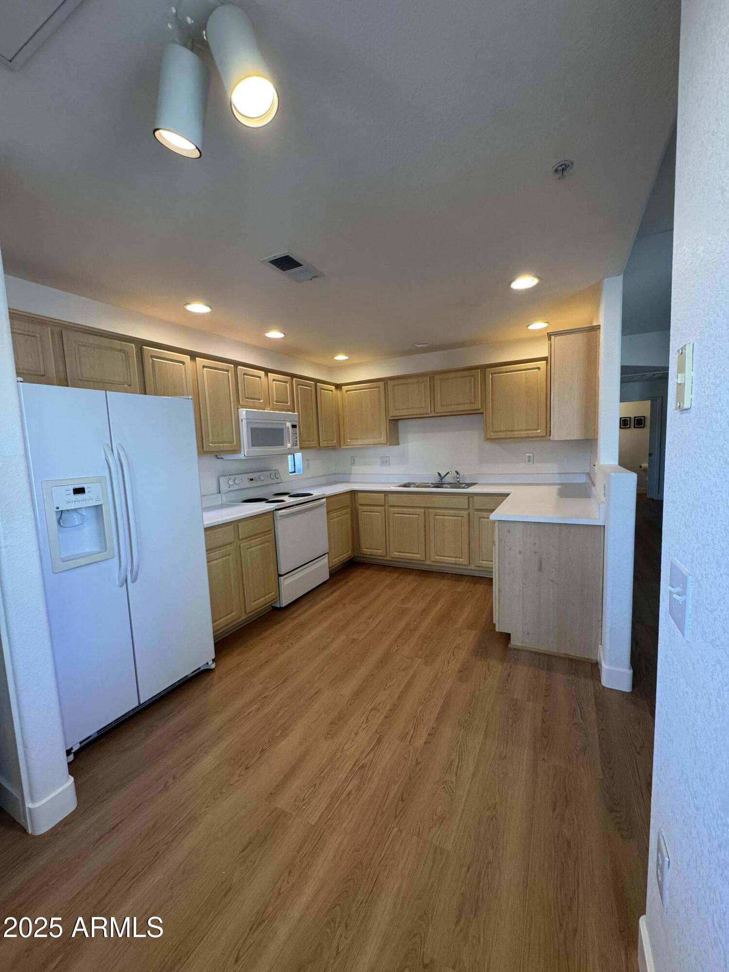 9555 East Raintree Drive, Unit 2008 Scottsdale, AZ 85260 - Photo 12 of 17 a large kitchen with a lot of counter space and appliances