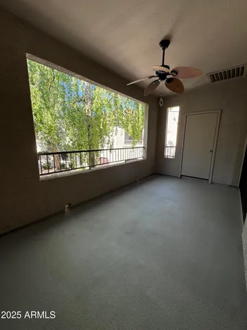 a view of an empty room with a window