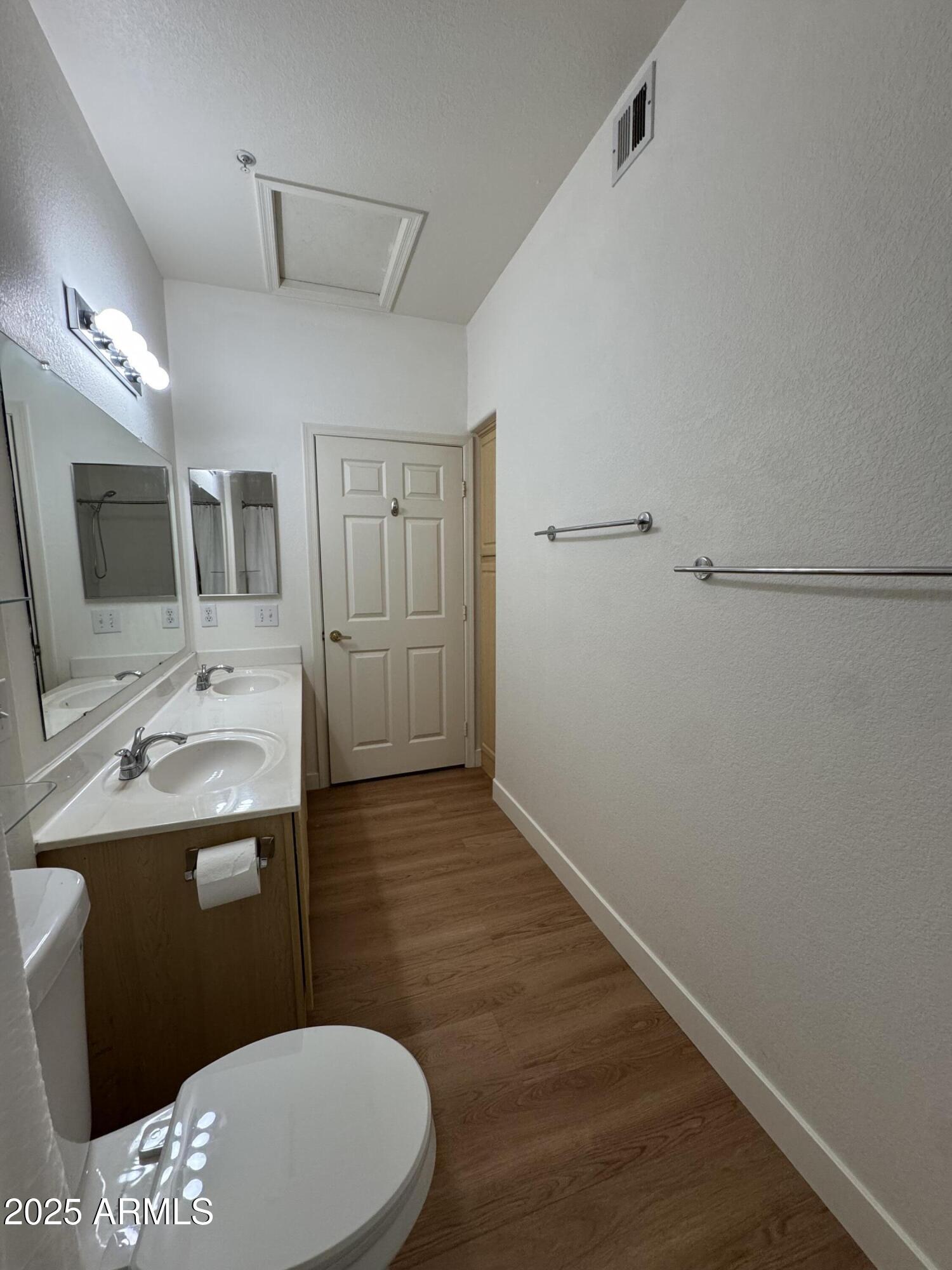 9555 East Raintree Drive, Unit 2008 Scottsdale, AZ 85260 - Photo 6 of 17 a bathroom with a sink a toilet and mirror