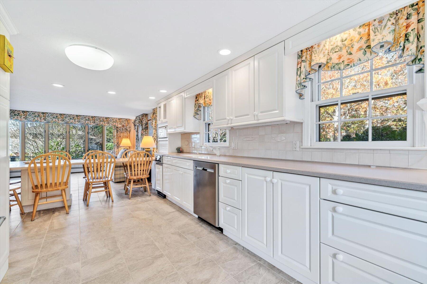 38 Nemasket Road West Falmouth, MA 02540 - Photo 12 of 51 a kitchen with appliances cabinets table and chairs