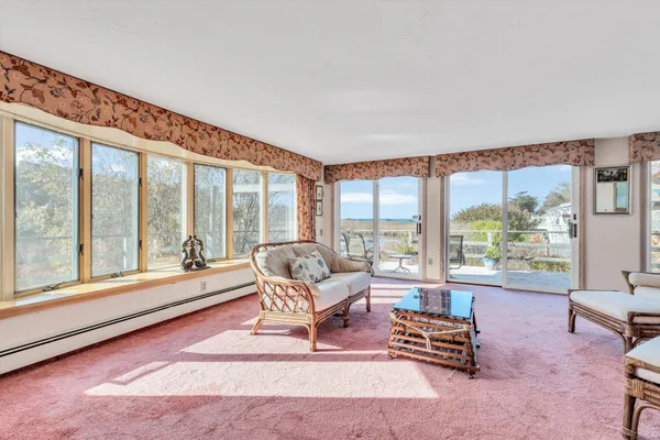 a swimming pool with yard in front of it