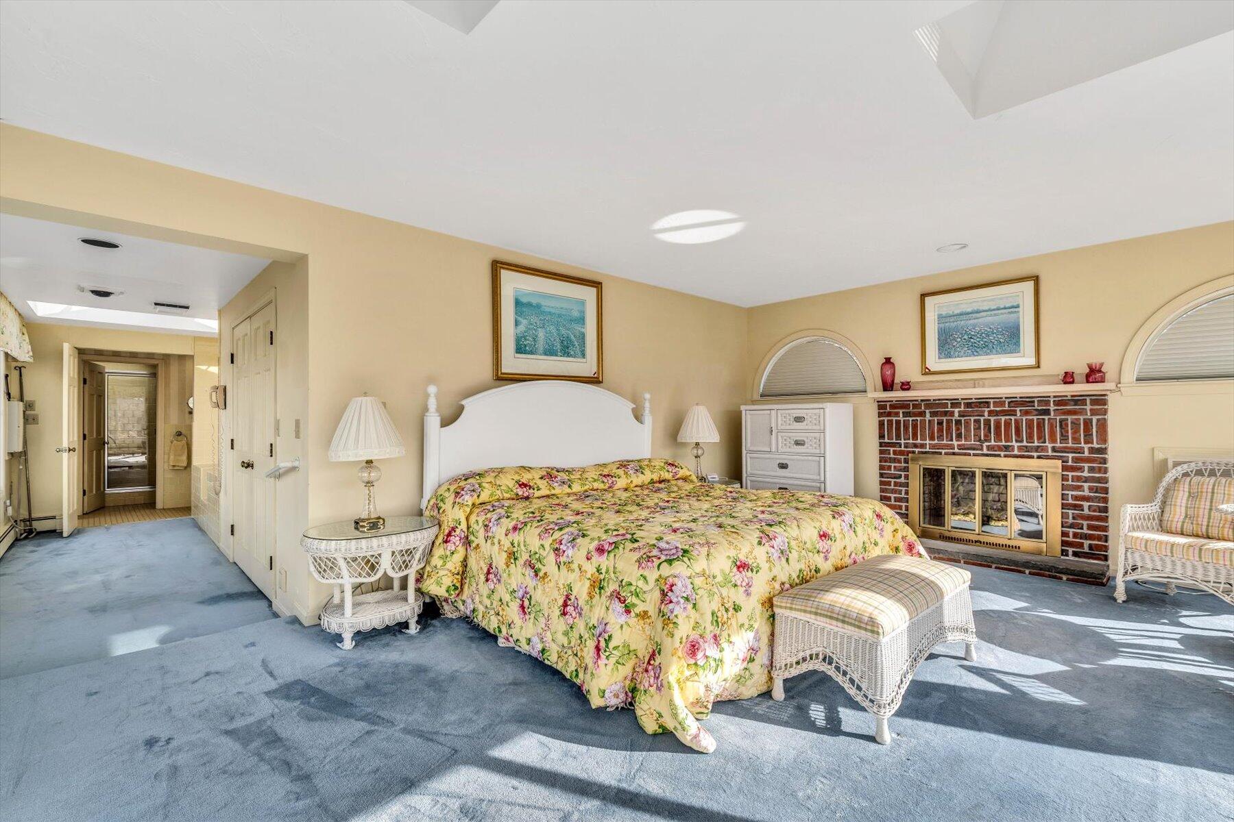 38 Nemasket Road West Falmouth, MA 02540 - Photo 25 of 51 a bedroom with a bed and a fireplace