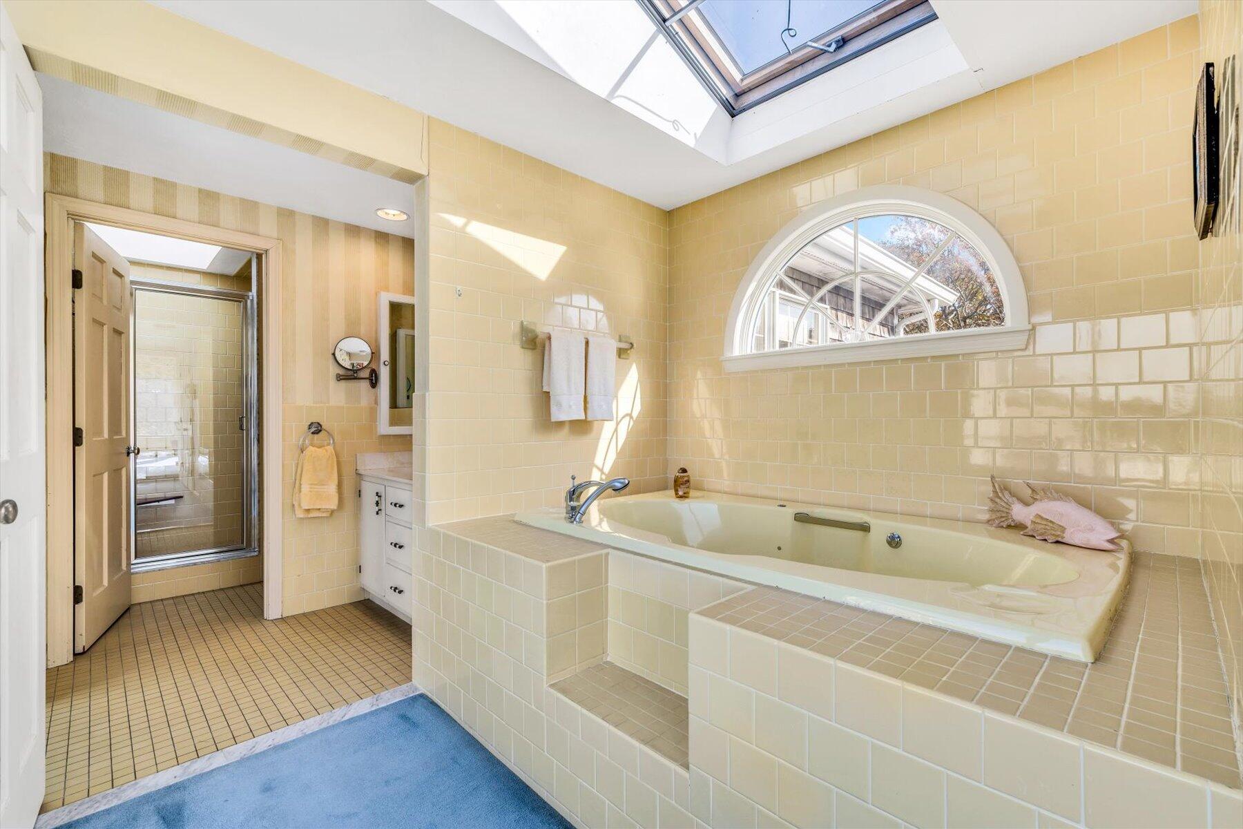 38 Nemasket Road West Falmouth, MA 02540 - Photo 28 of 51 a spacious bathroom with a tub sink and mirror