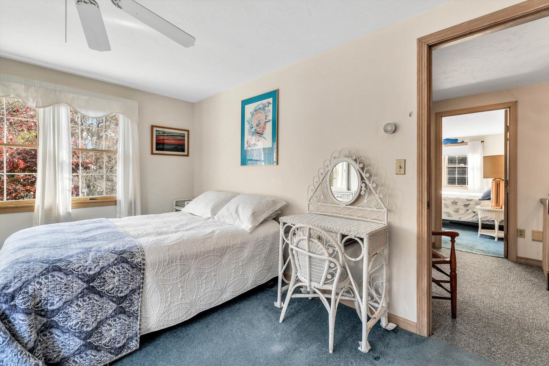 38 Nemasket Road West Falmouth, MA 02540 - Photo 33 of 51 a bedroom with a bed window and a table in it