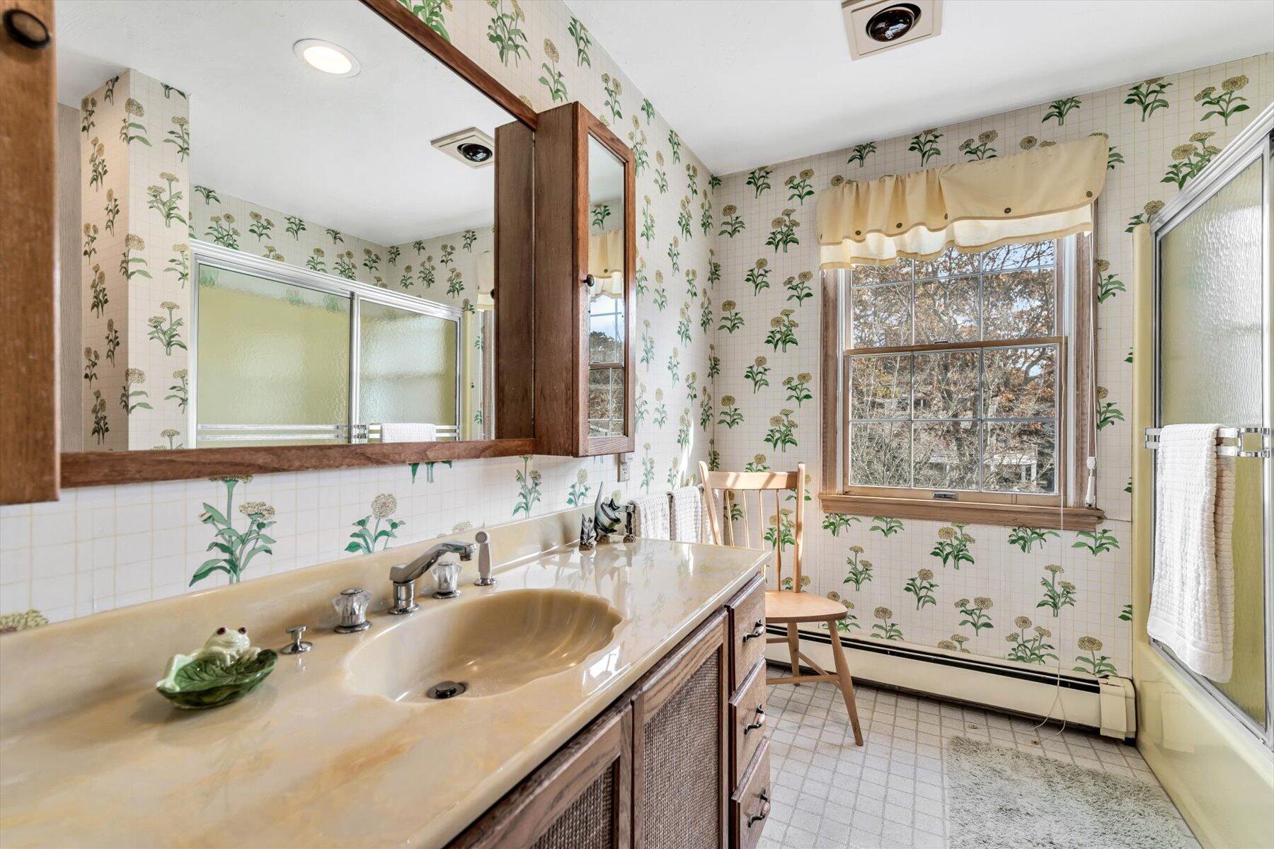 38 Nemasket Road West Falmouth, MA 02540 - Photo 34 of 51 a bathroom with double vanity sinks and a mirror