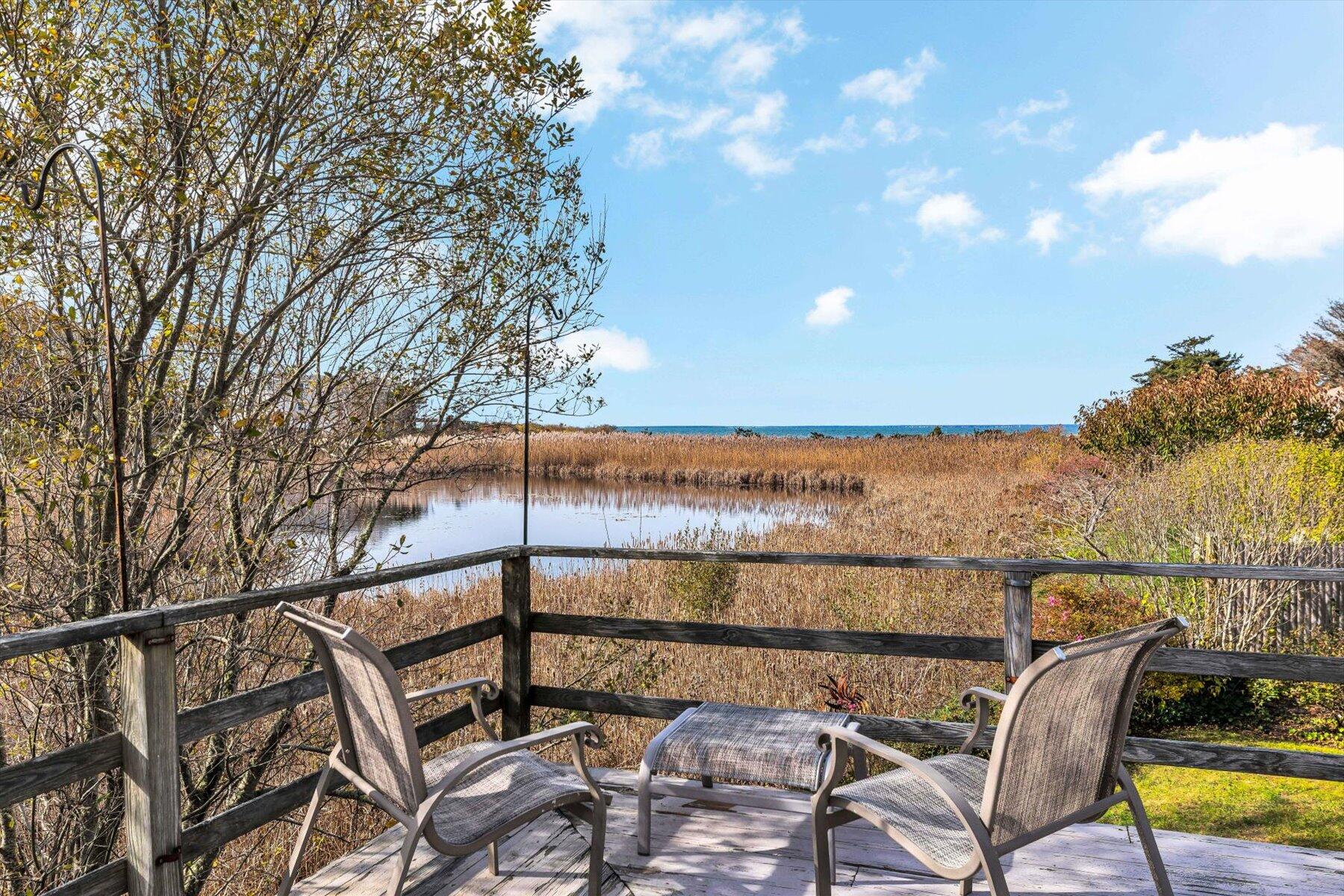 38 Nemasket Road West Falmouth, MA 02540 - Photo 8 of 51 a view of a chairs and table on the terrace