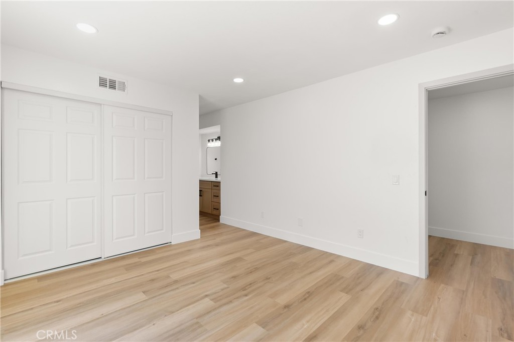 87 Tennessee Street, Unit C Redlands, CA 92373 - Photo 24 of 32 a view of an empty room with wooden floor