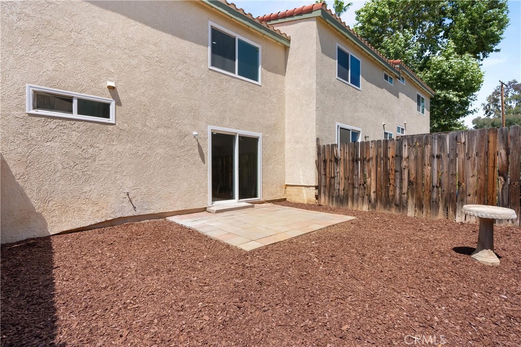 87 Tennessee Street, Unit C Redlands, CA 92373 - Photo 27 of 32 a view of a house with backyard and wooden fence