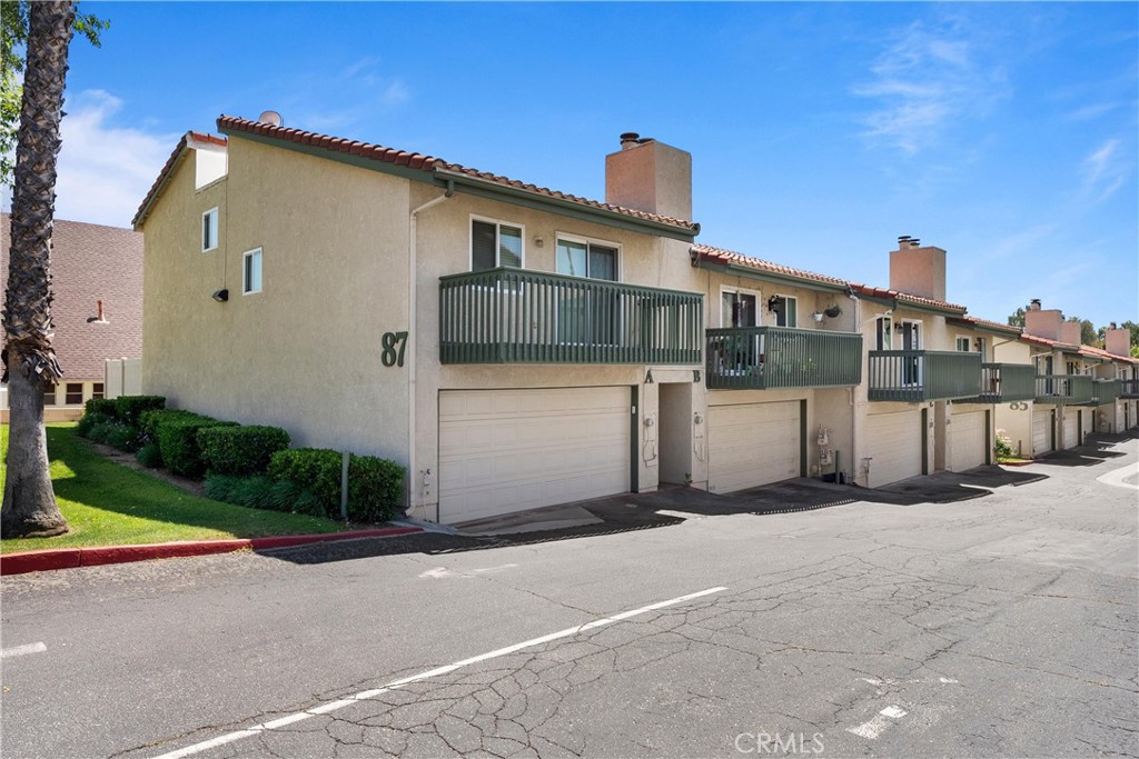 87 Tennessee Street, Unit C Redlands, CA 92373 - Photo 31 of 32 a view of a house with a yard