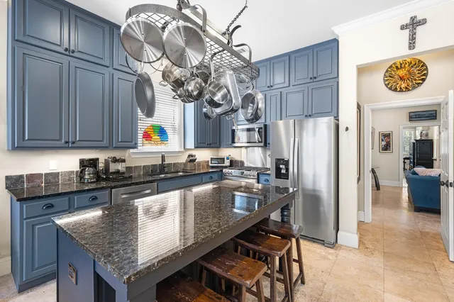 a bathroom with a double vanity sink mirror and shower