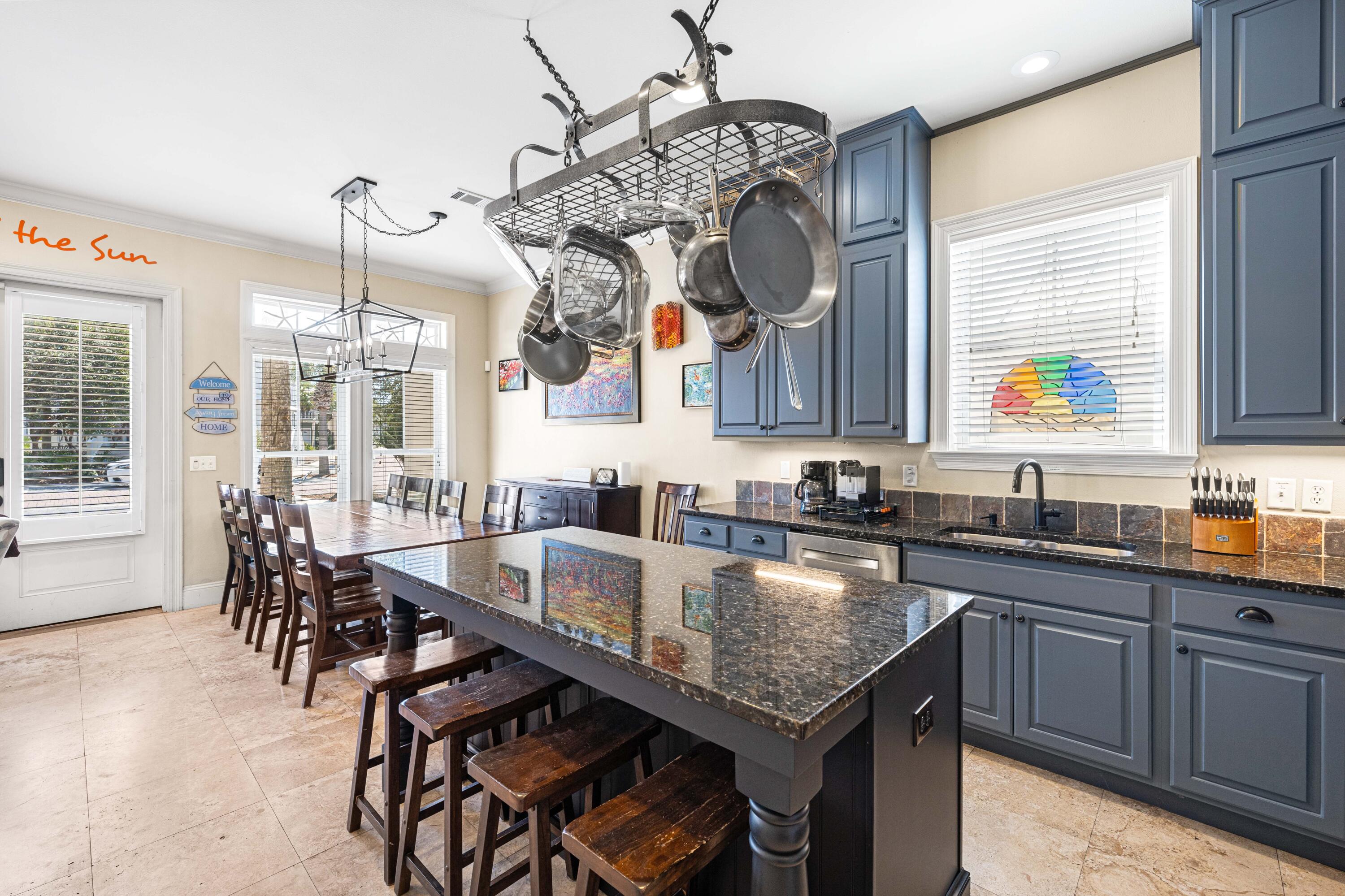 38 Endless Summer Way West Seacrest, FL 32461 - Photo 21 of 67 a kitchen with granite countertop a table chairs in it and wooden floors