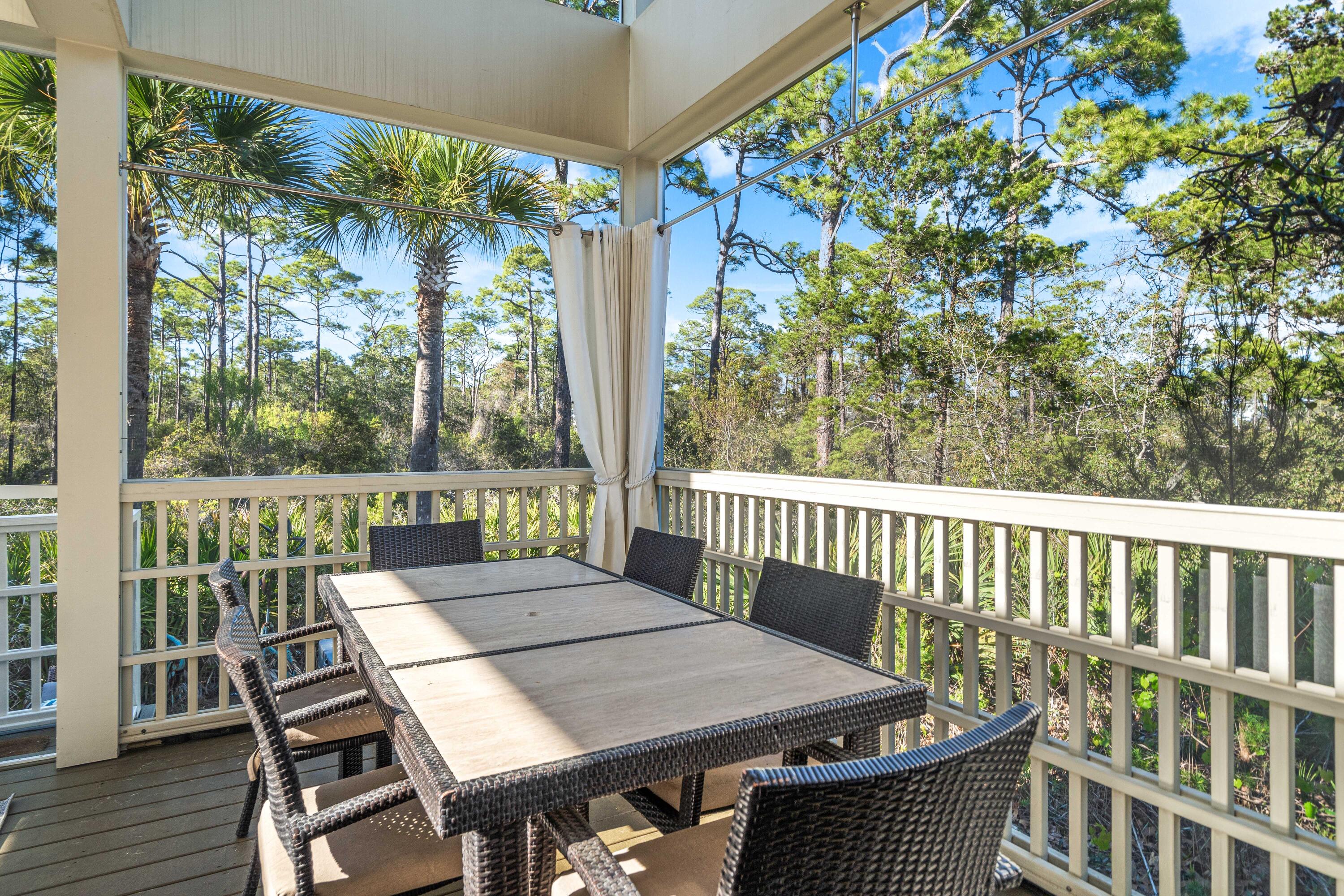 38 Endless Summer Way West Seacrest, FL 32461 - Photo 32 of 67 a view of a balcony with a table and chairs