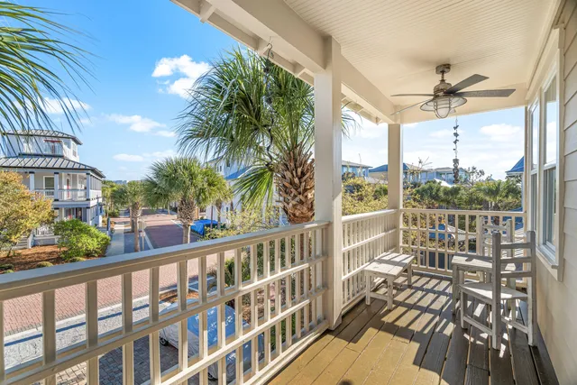 a bedroom with a bed a dresser and a window