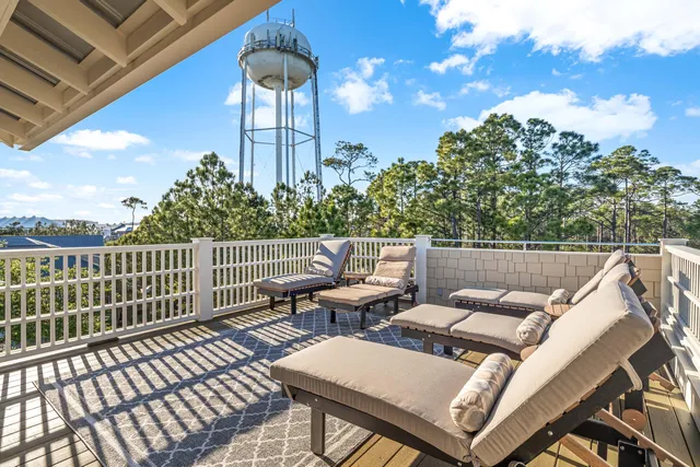 a view of a balcony with wooden floor