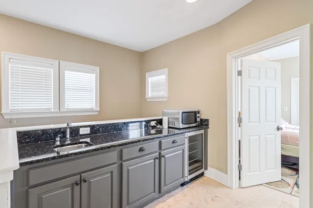 a view of yard with swimming pool and trees in the background