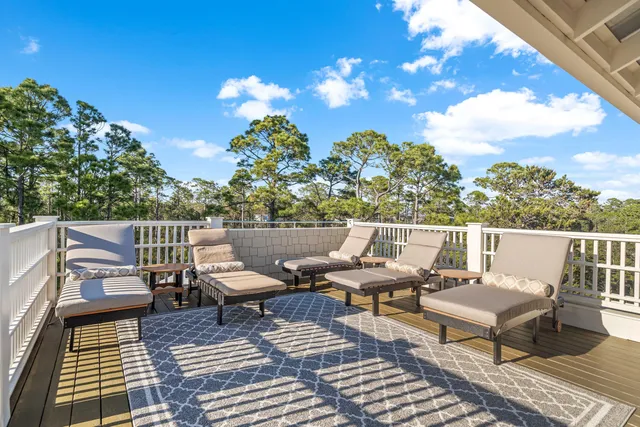 a view of a balcony with furniture