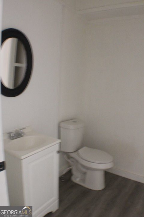 480 River Road Eastman, GA 31023 - Photo 12 of 23 a white toilet sitting next to a bathroom sink