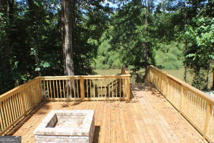 480 River Road Eastman, GA 31023 - Photo 13 of 23 a view of balcony with wooden floor and fence