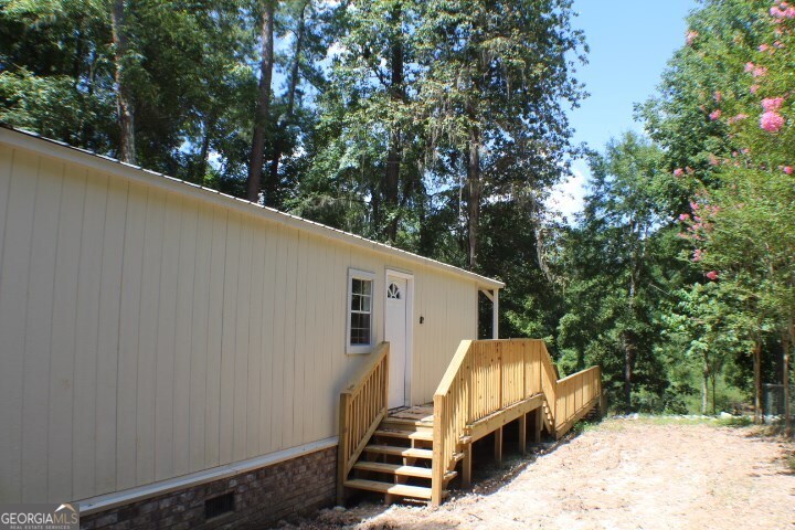 480 River Road Eastman, GA 31023 - Photo 23 of 23 a view of a back yard of the house