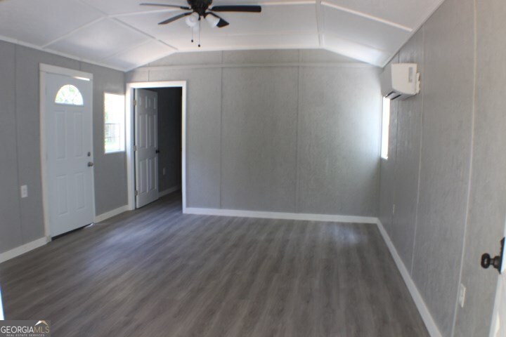480 River Road Eastman, GA 31023 - Photo 5 of 23 wooden floor in an empty room with a window