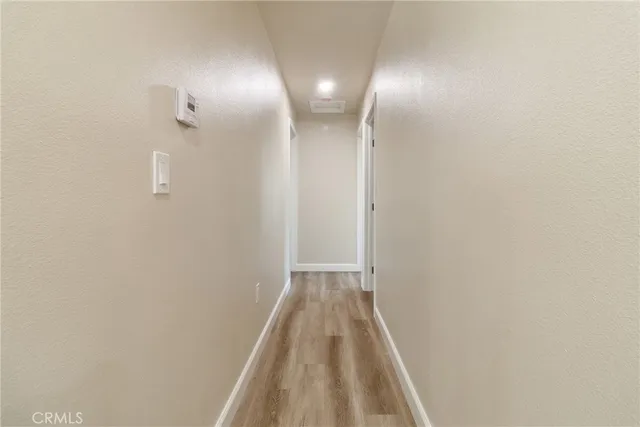 a bathroom with a granite countertop toilet and sink
