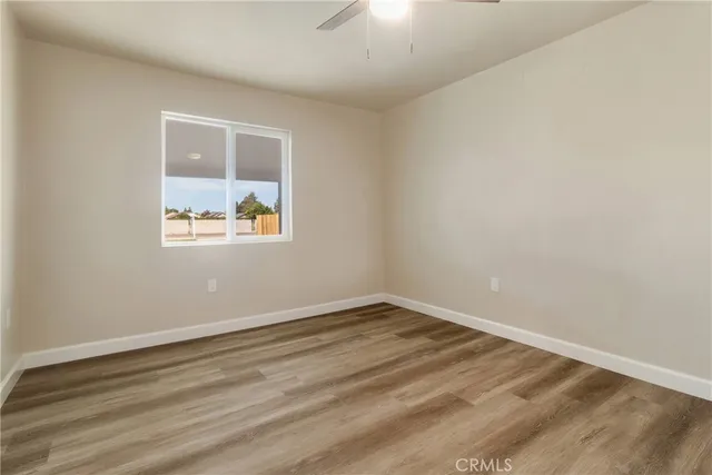 a picture of a bench in front of a wall