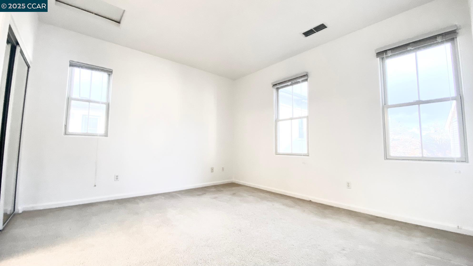 1027 Main Street, Unit B Hercules, CA 94547 - Photo 32 of 39 an empty room with windows