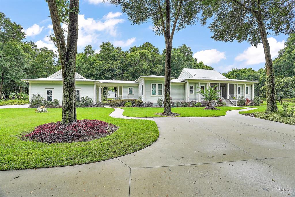 20201 Grass Roots Road Groveland, FL 34736 - Photo 1 of 1 Beautiful 3+ Acre Estate with Private Airplane Hanger and Attached Covered Storage